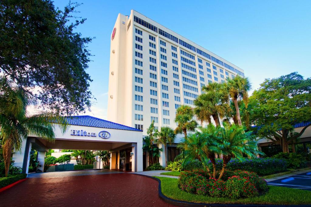 a hotel building with a walkway in front of it at Hilton St. Petersburg Bayfront in St Petersburg