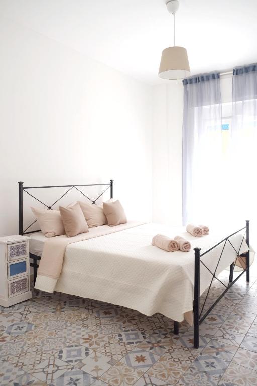 Postel nebo postele na pokoji v ubytování NERI Rooms