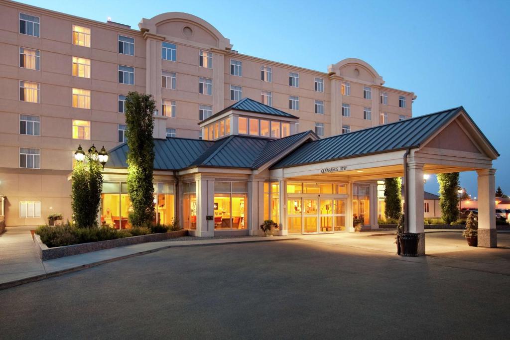 a hotel with a pavilion in front of a building at Hilton Garden Inn West Edmonton in Edmonton