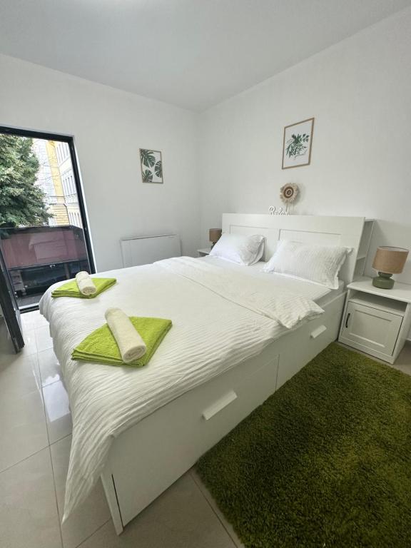 Postel nebo postele na pokoji v ubytování Green Central Apartment