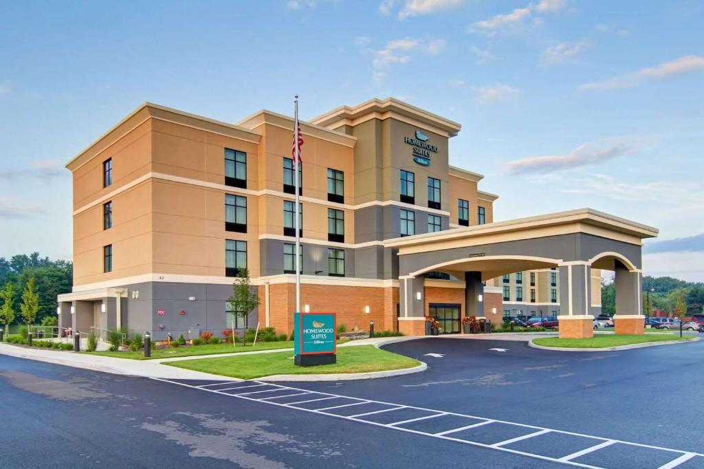 une représentation de l'avant d'un hôtel dans l'établissement Homewood Suites By Hilton Clifton Park, à Clifton Park