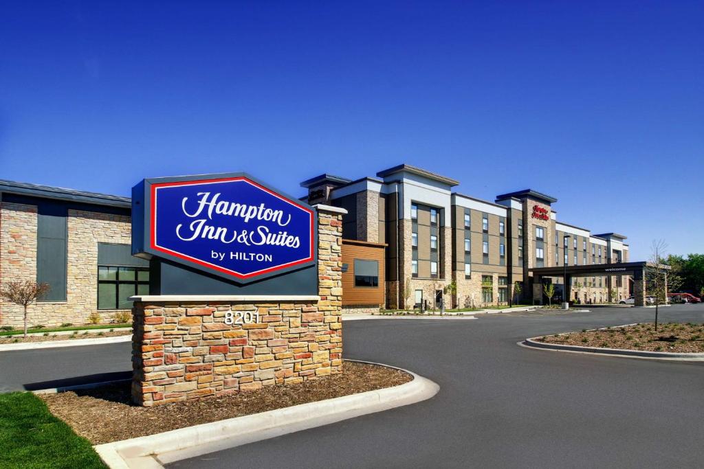 a sign for a hampton inn and suites at Hampton Inn & Suites Milwaukee West in West Allis