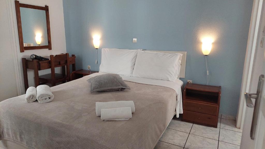 Postel nebo postele na pokoji v ubytování Olympic Villas