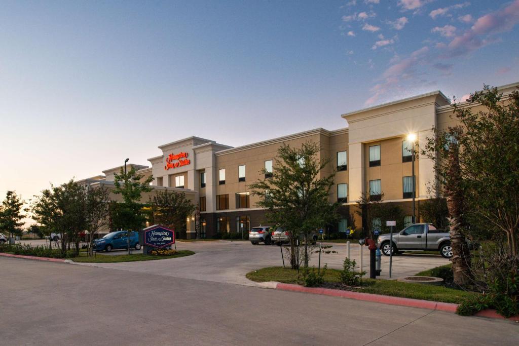 a rendering of a hotel with a parking lot at Hampton Inn and Suites Hutto in Hutto