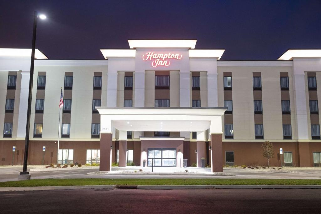 a large white building with a sign on it at Hampton Inn & Suites - Toledo/Oregon in Oregon