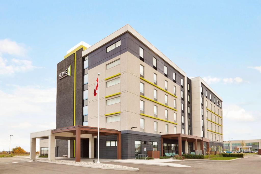 a rendering of the hotel exterior at Home2 Suites by Hilton Milton Ontario in Milton