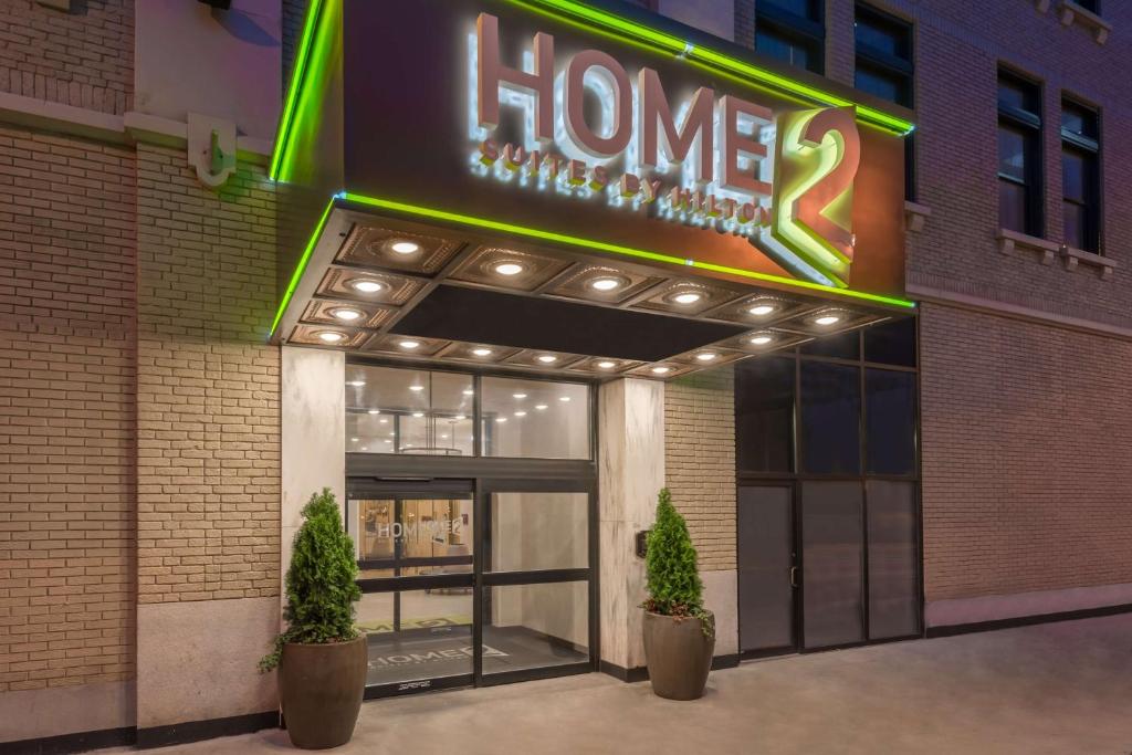 a store front of a house with a neon sign at Home2 Suites by Hilton Atlanta Downtown in Atlanta