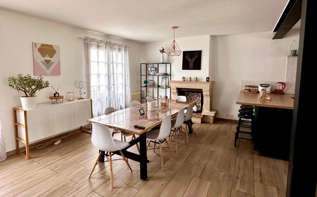 a dining room with a table and chairs at Family Oasis with 3 bedrooms near Paris in Chennevières-sur-Marne