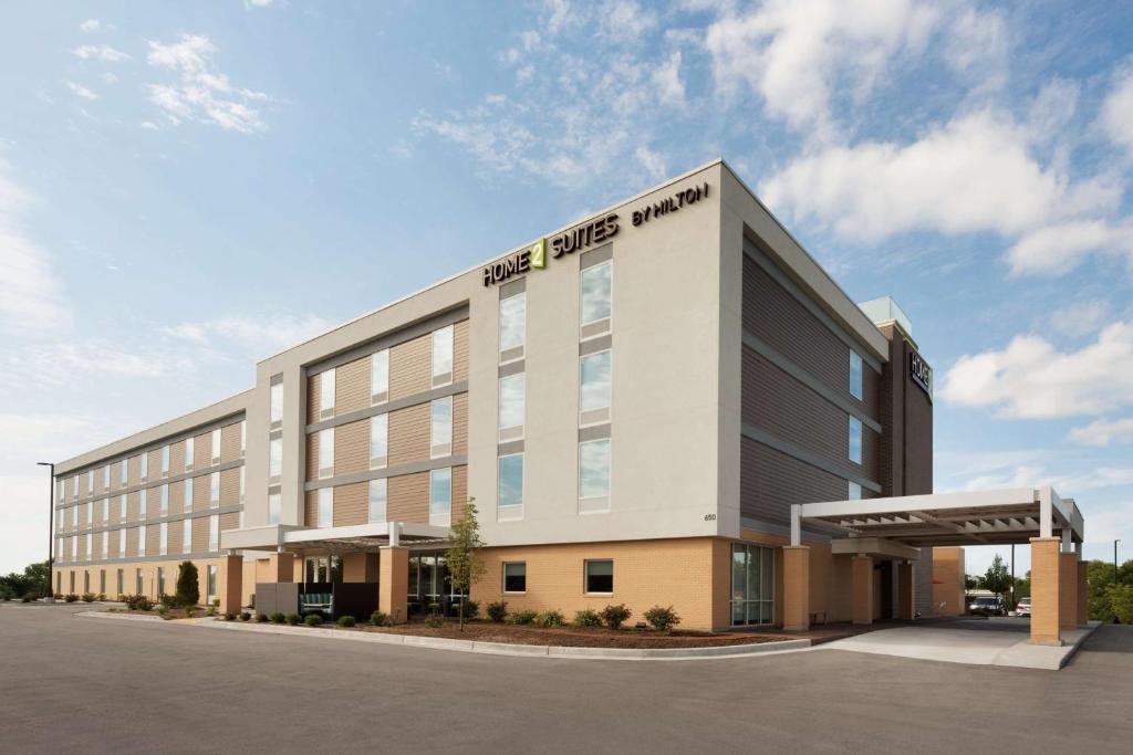 a large building with the words the pride hotel at Home2 Suites by Hilton Milwaukee Brookfield in Waukesha