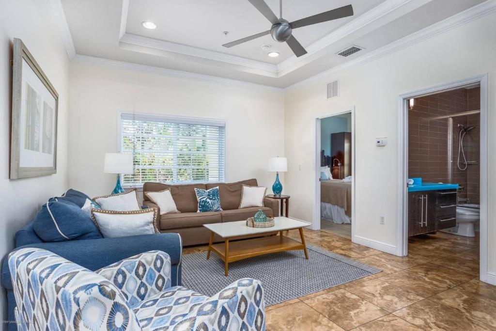 a living room with a couch and a table at Beach Club at Siesta Key Poolside D in Point O'Rocks