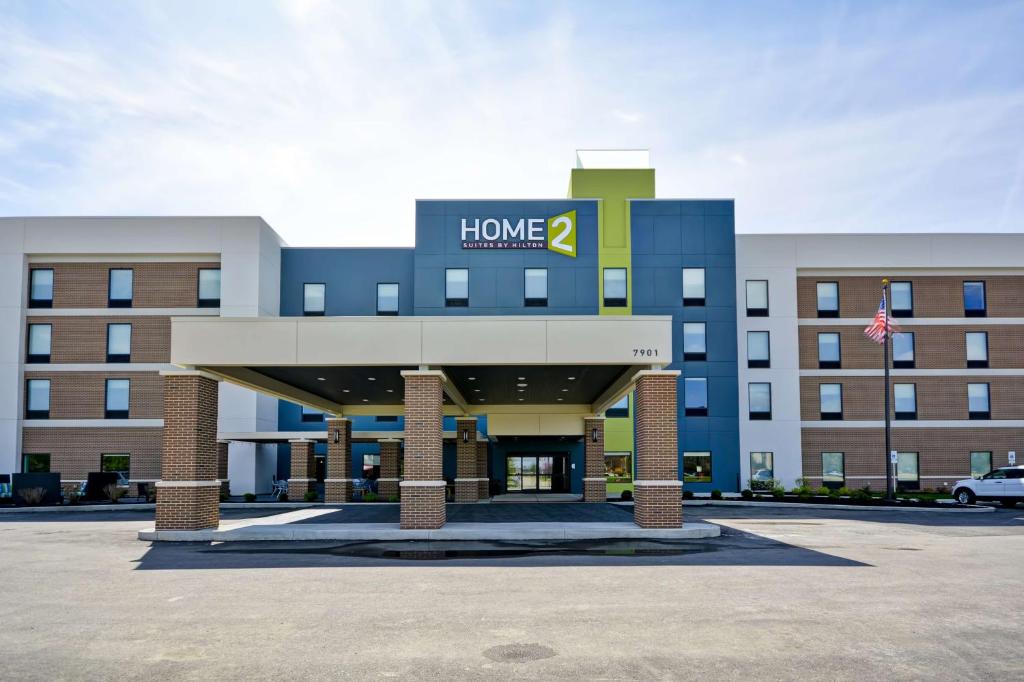 a building with a home sign on top of it at Home2 Suites By Hilton Evansville in Evansville
