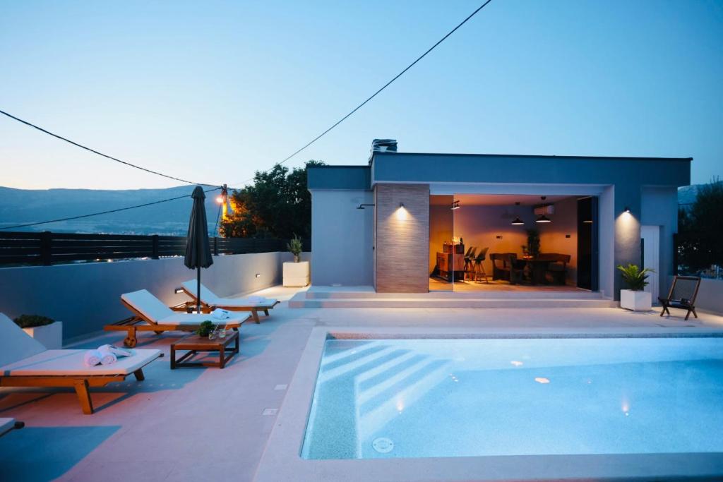 a swimming pool on the roof of a house at Holiday Home TiA in Split
