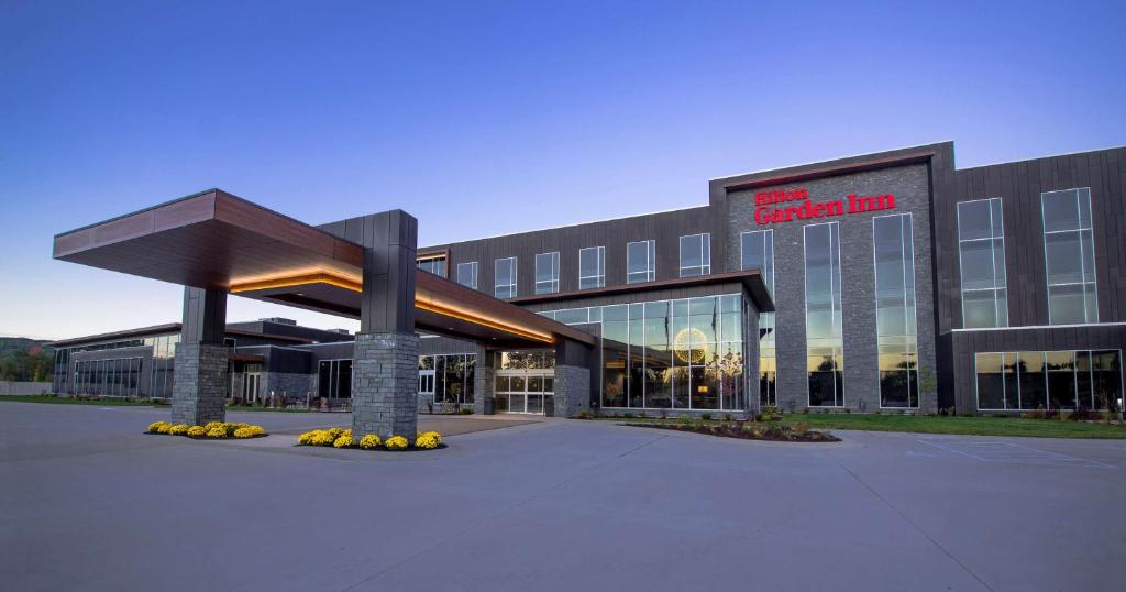 a large building with a sign on the front of it at Hilton Garden Inn Wausau, WI in Wausau