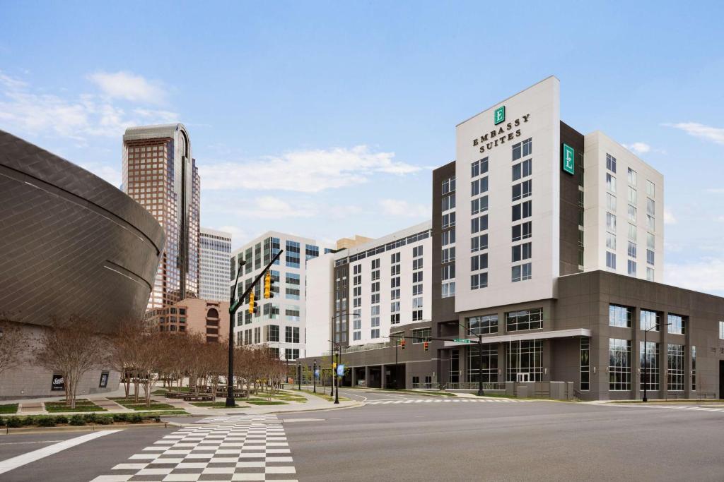 an empty street in a city with tall buildings at Embassy Suites by Hilton Charlotte Uptown in Charlotte