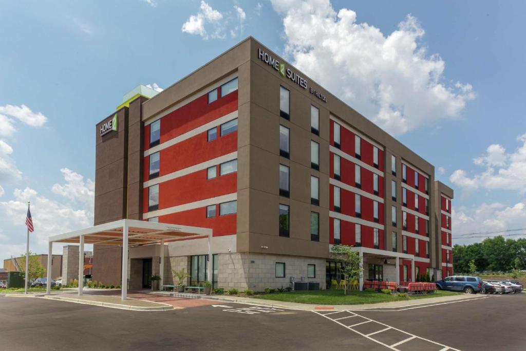 a rendering of a hotel with a parking lot at Home2 Suites By Hilton Louisville Airport Expo Center in Louisville