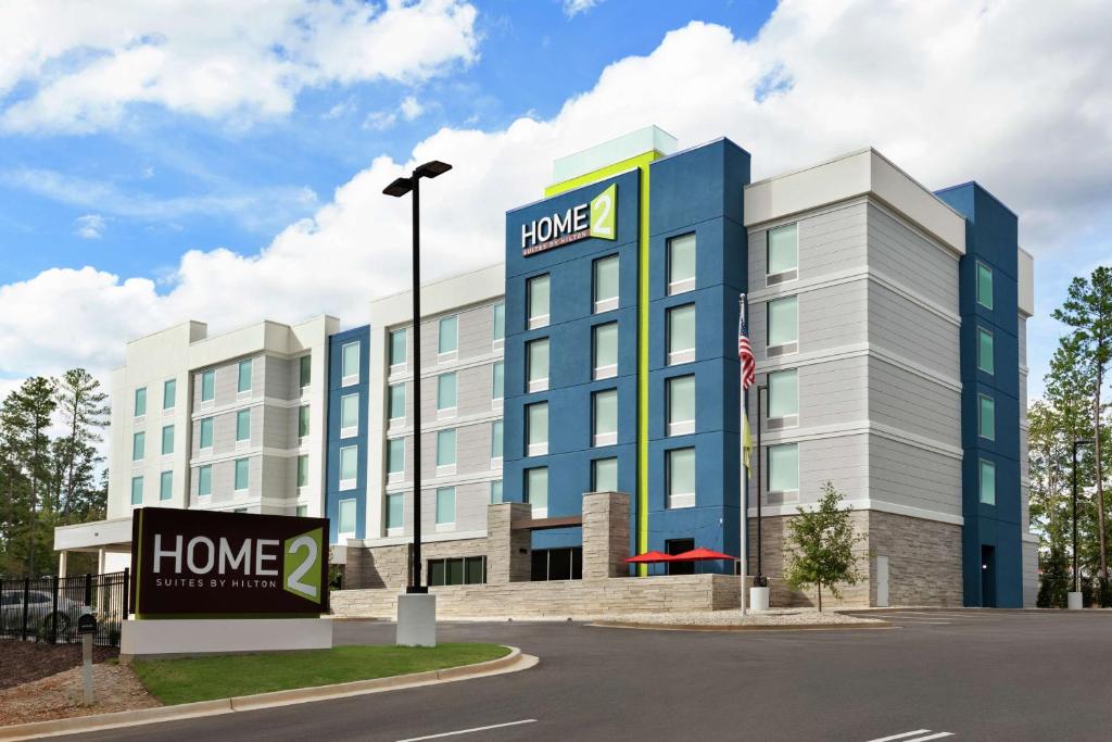 a building with a home sign in front of it at Home2 Suites By Hilton Columbia Harbison in Columbia