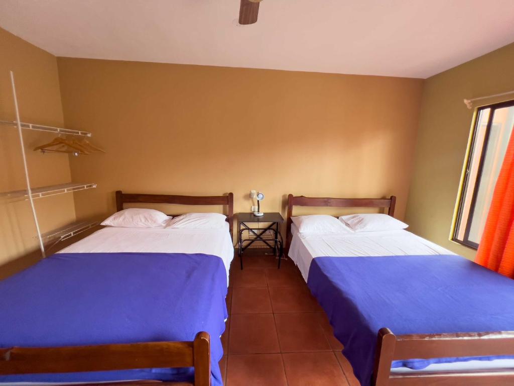 Postel nebo postele na pokoji v ubytování Belen Suites