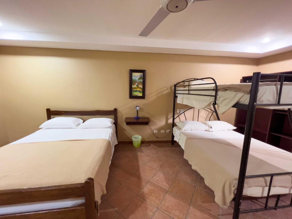 Postel nebo postele na pokoji v ubytování Belen Suites