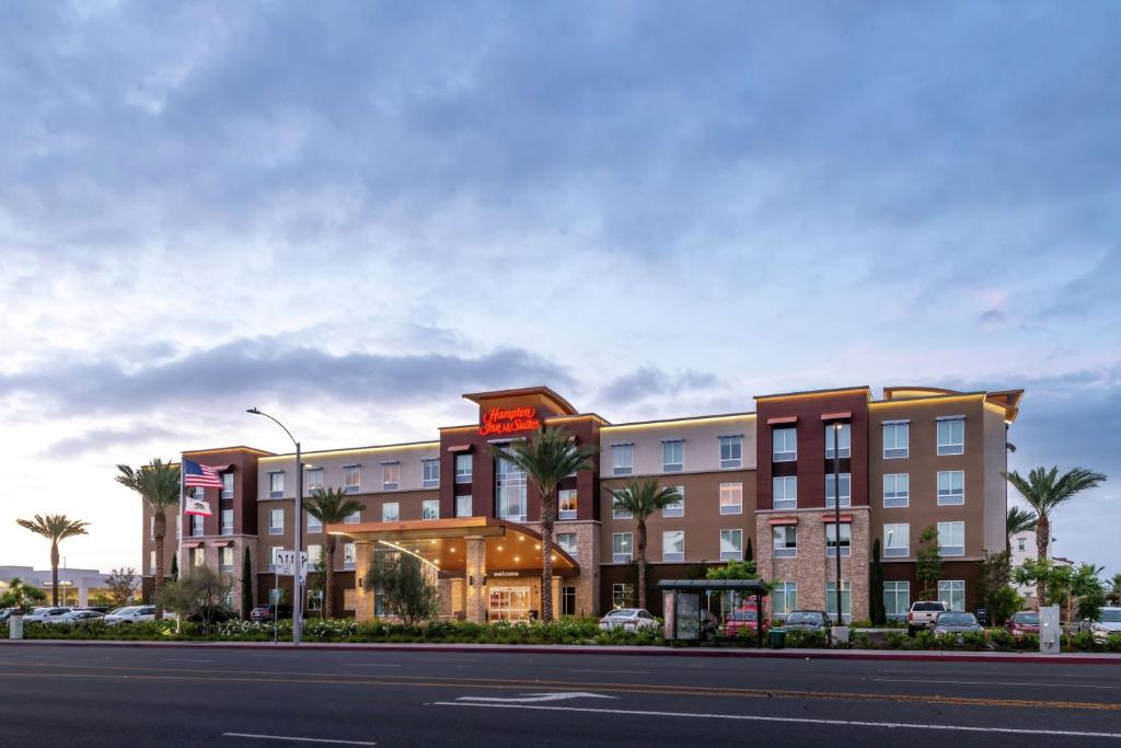 a rendering of a hotel on the side of a street at Hampton Inn & Suites Buena Park in Buena Park