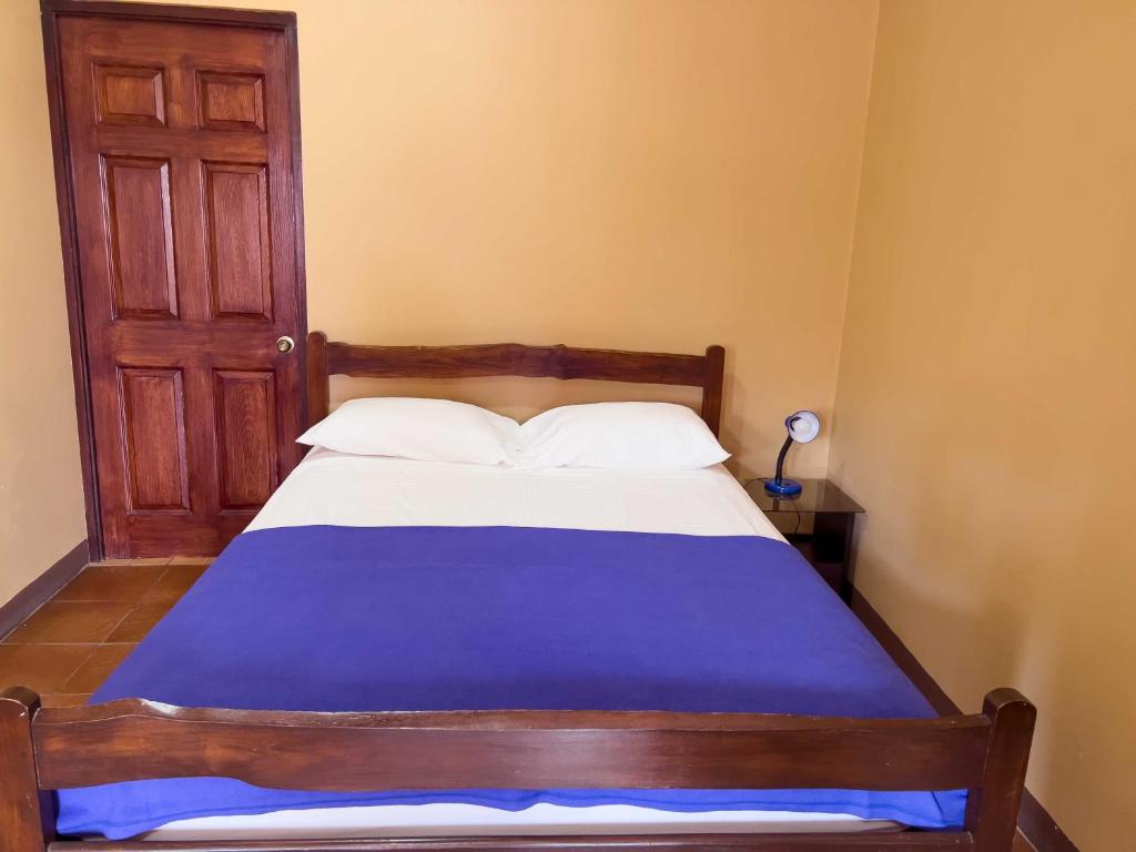 Postel nebo postele na pokoji v ubytování Belen Suites