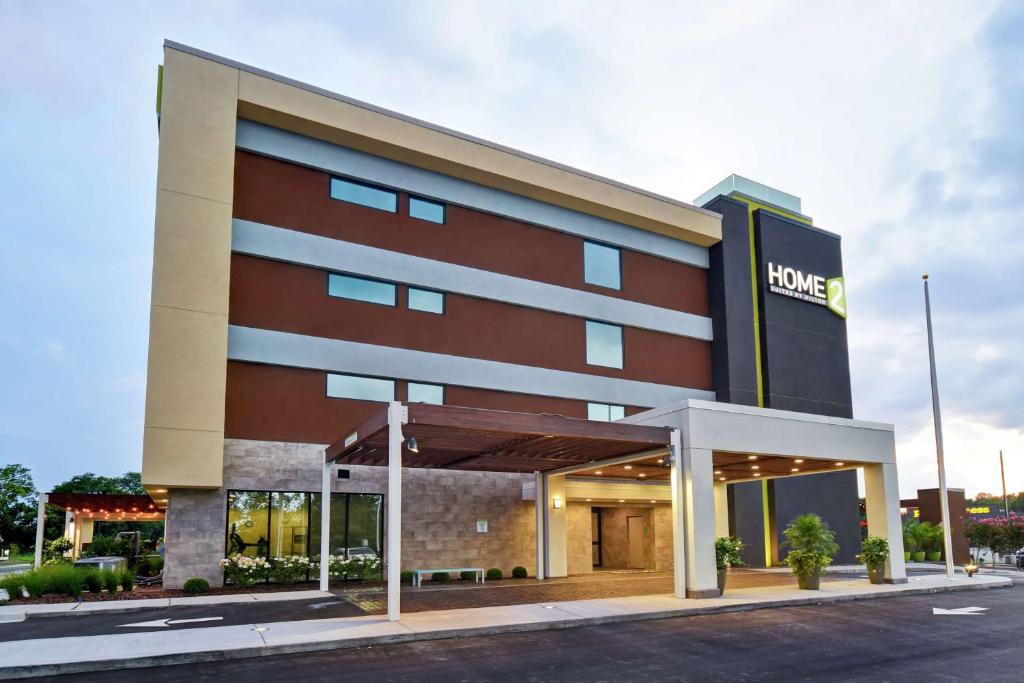 a hotel with a sign on the front of it at Home2 Suites By Hilton Frankfort in Frankfort