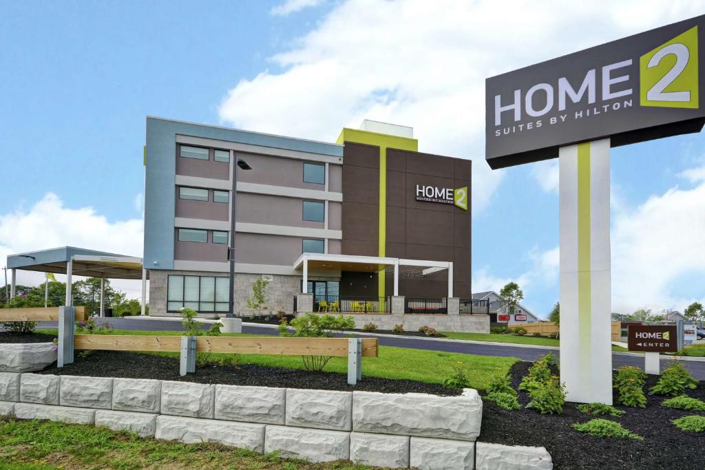 a home building with a sign in front of it at Home2 Suites By Hilton Portland Airport in South Portland