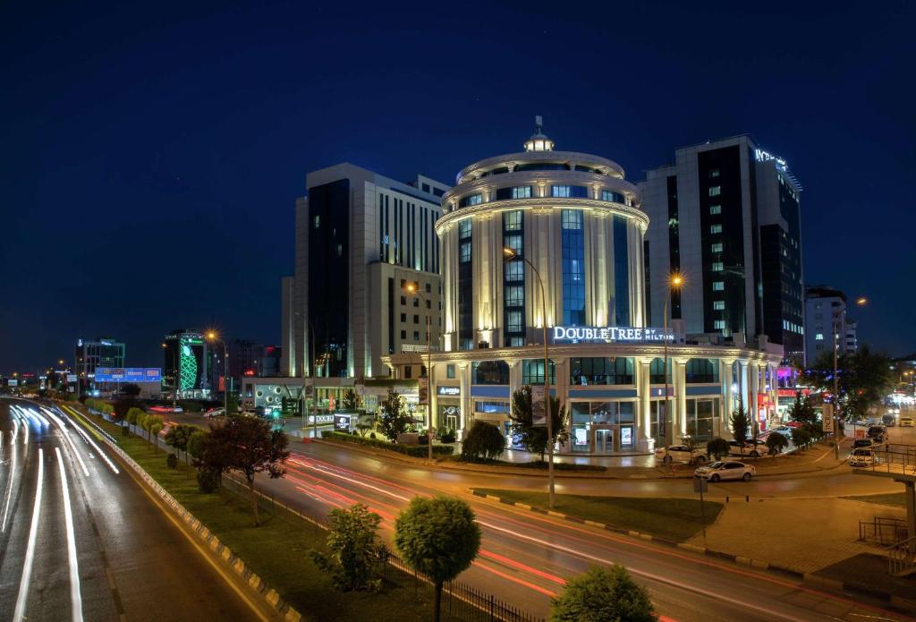 a city at night with a building and traffic at DoubleTree By Hilton Gaziantep in Gaziantep