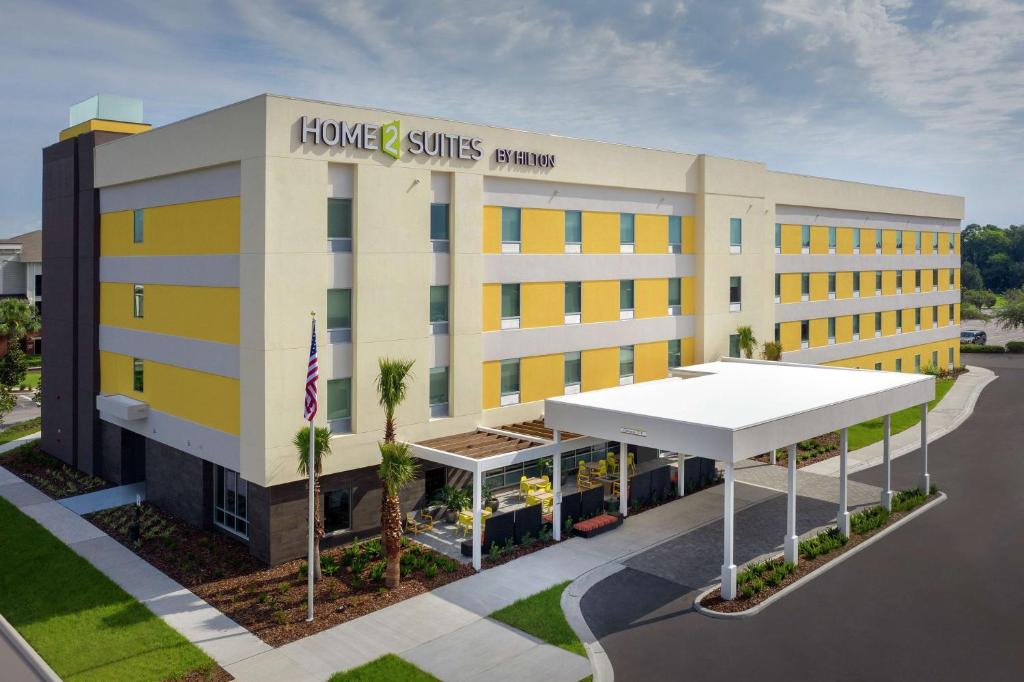 a rendering of a hotel with a building at Home2 Suites By Hilton Lakeland in Lakeland