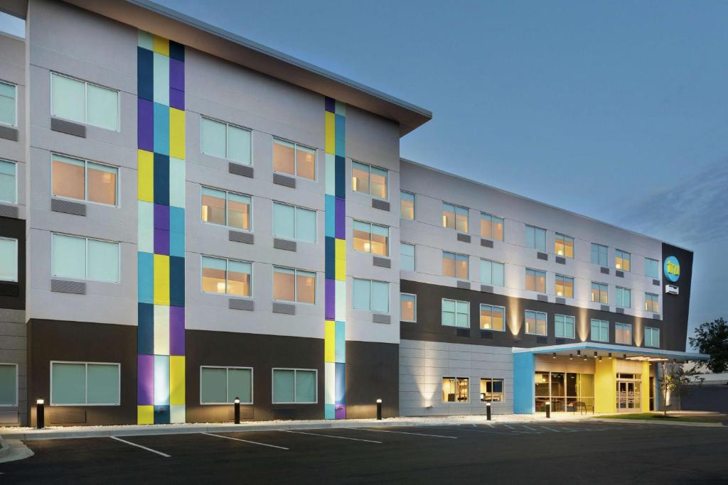 a building with a rainbow painted on the side of it at Tru By Hilton Harbison Columbia in Columbia