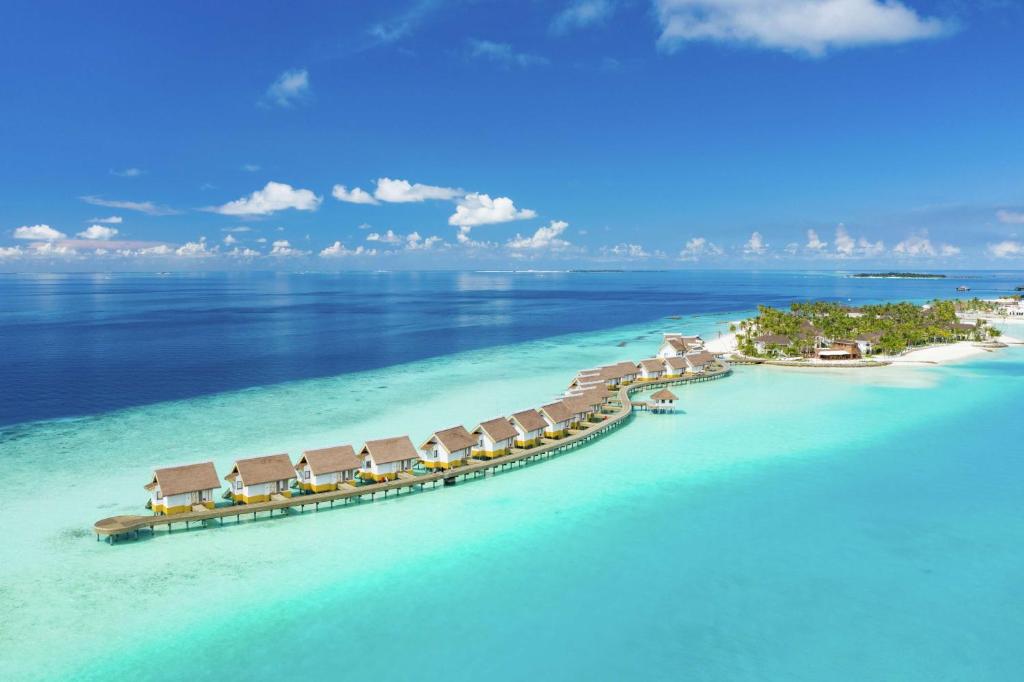 an aerial view of a resort in the ocean at SAii Lagoon Maldives, Curio Collection By Hilton in South Male Atoll