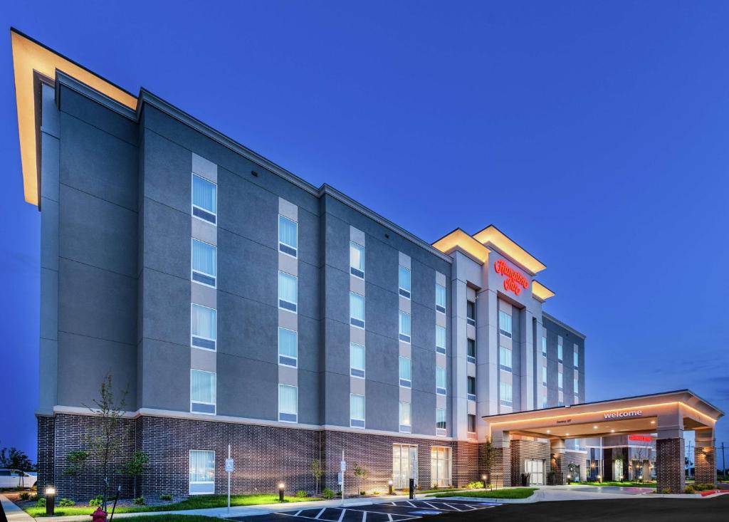 a rendering of a hotel building with a parking lot at Hampton Inn Gardner in Gardner