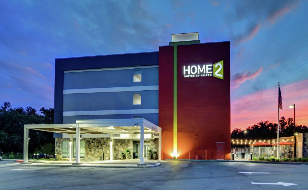 a large building with a home sign on it at Home2 Suites By Hilton Foley in Foley