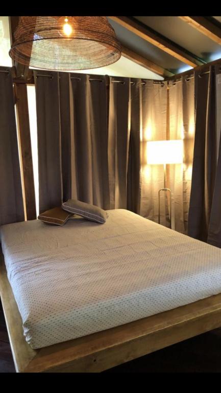 Letto o letti in una camera di AgriGlamping La Diaccia