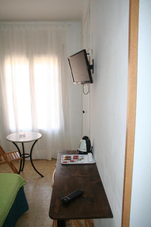 TV a/nebo společenská místnost v ubytování Hostal Juventus