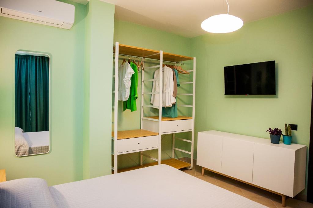 A bed or beds in a room at Le Colonne