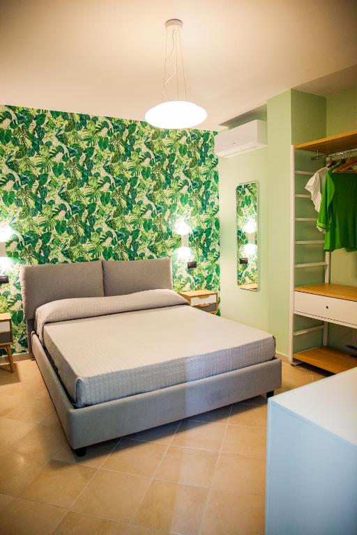 A bed or beds in a room at Le Colonne