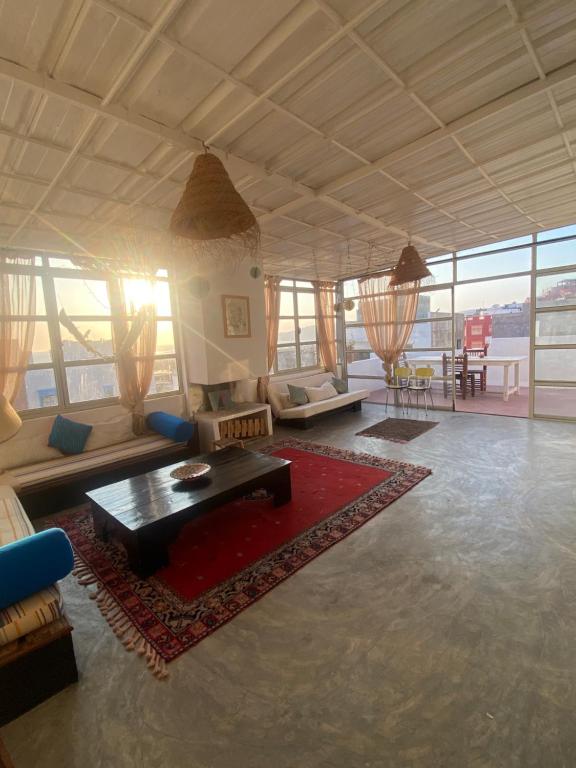 a living room with a couch and a table at Anir of sea tamraght in Agadir