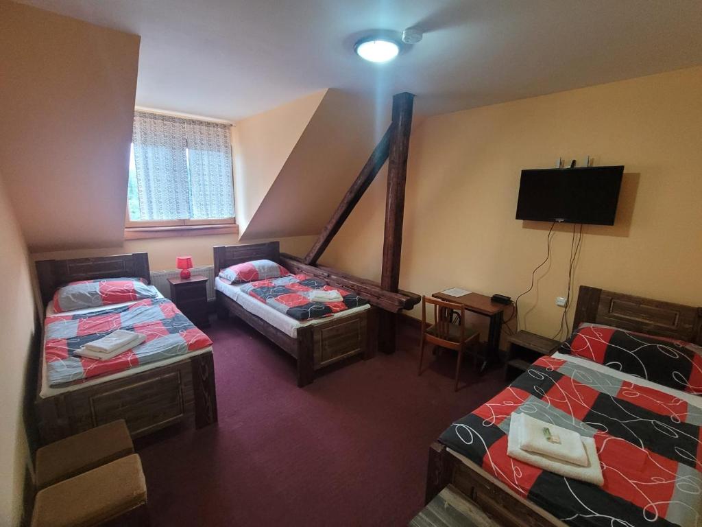 Postel nebo postele na pokoji v ubytování Hotel Max Šimek