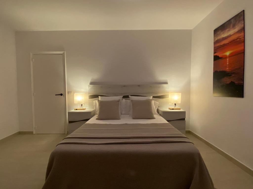 Postel nebo postele na pokoji v ubytování APARTAMENTS L’ARC