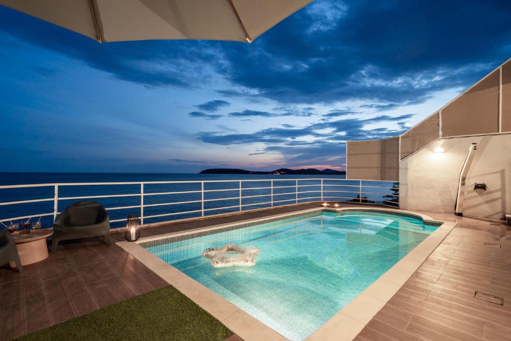 a swimming pool on the deck of a cruise ship at Villa Luce Dubrovnik in Dubrovnik