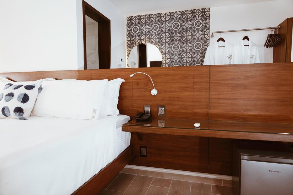 Postel nebo postele na pokoji v ubytování Nuxká Hotel