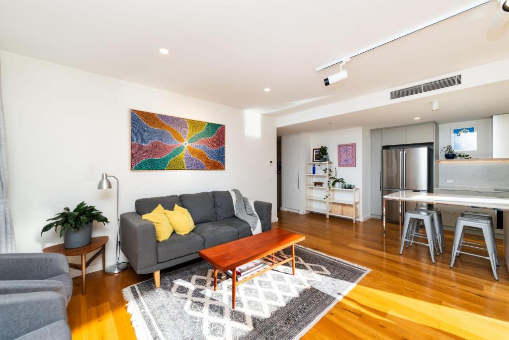 a living room with a couch and a table at Accommodate Canberra - Canberra 22 in Kingston 