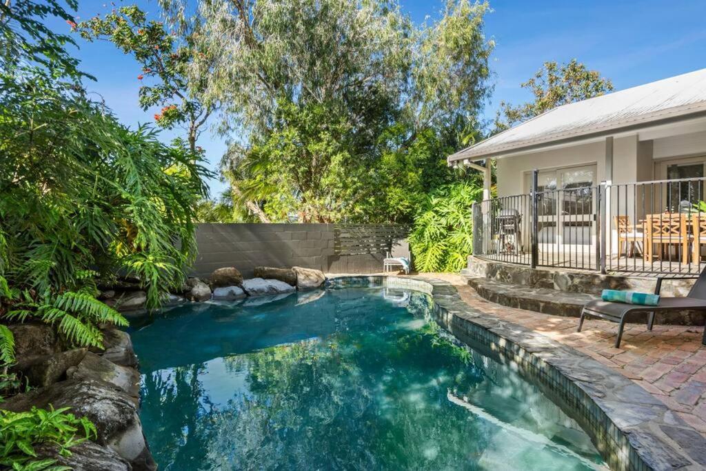 a swimming pool in the backyard of a house at The Pod in Peregian Beach