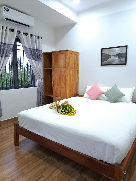 Postel nebo postele na pokoji v ubytování GREEN TOWN hotel HỘI AN