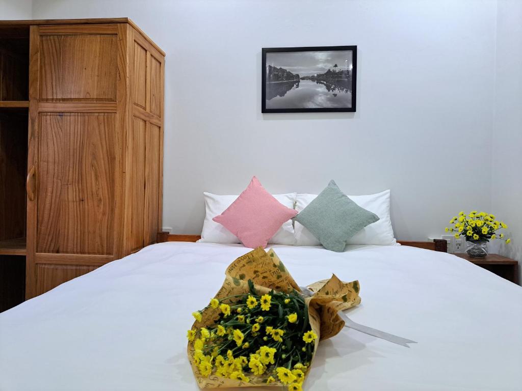 Postel nebo postele na pokoji v ubytování GREEN TOWN hotel HỘI AN
