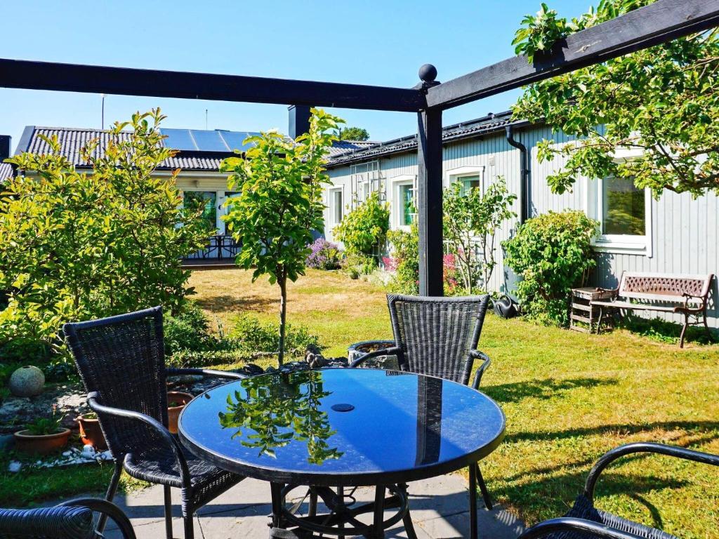 a table and chairs on a patio in a yard at 5 person holiday home in VISBY-By Traum in Visby