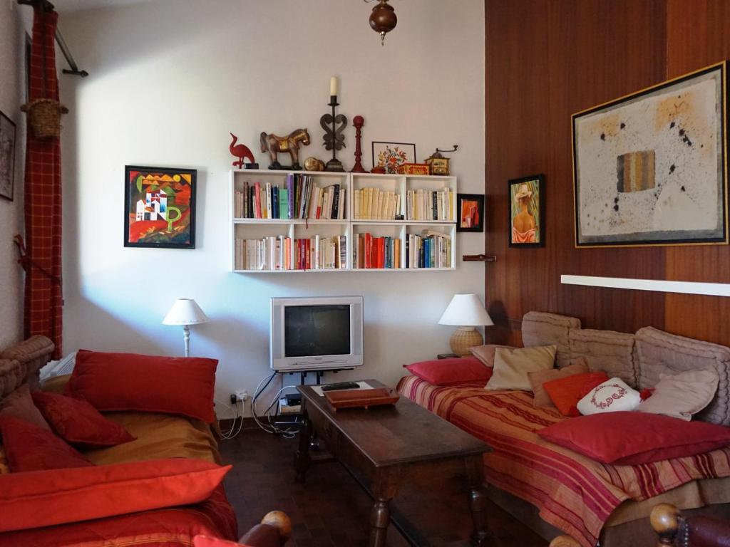 a living room with two couches and a tv at Maison Autrans, 3 pièces, 4 personnes - FR-1-737-41 in Autrans