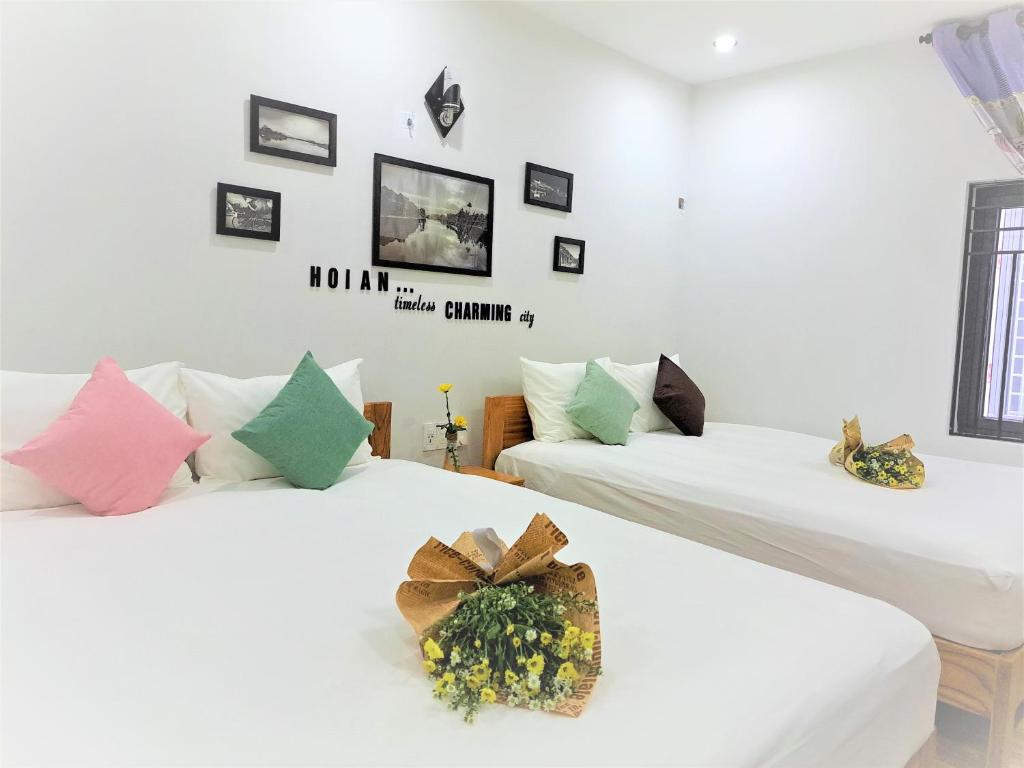 Postel nebo postele na pokoji v ubytování GREEN TOWN hotel HỘI AN