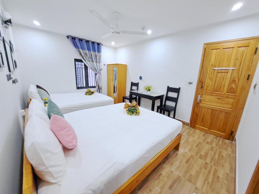 Postel nebo postele na pokoji v ubytování GREEN TOWN hotel HỘI AN