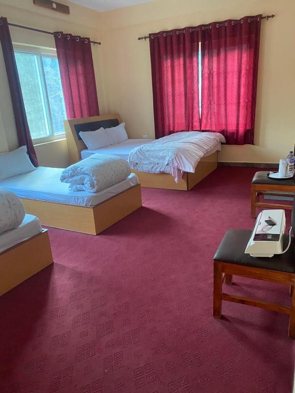 Letto o letti in una camera di Prashiddha Resort